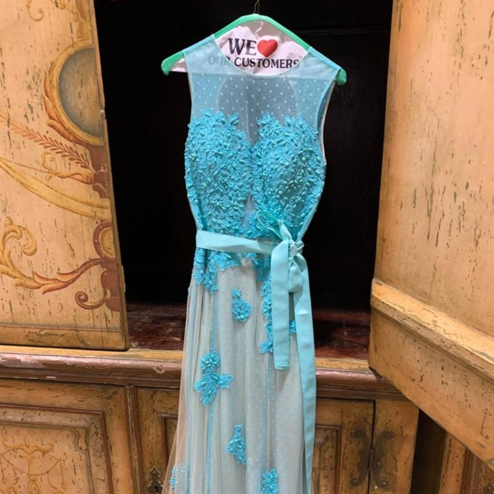 Camille La Vie sexy turquoise gown worth over $700